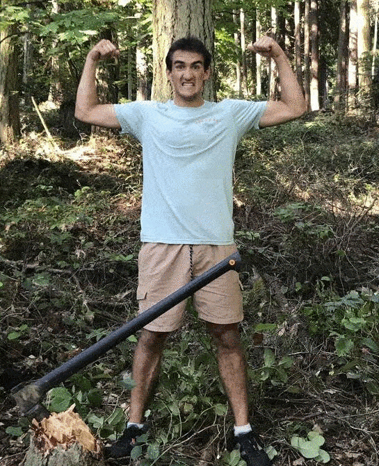 Thomas cuts down a tree and is very proud of it